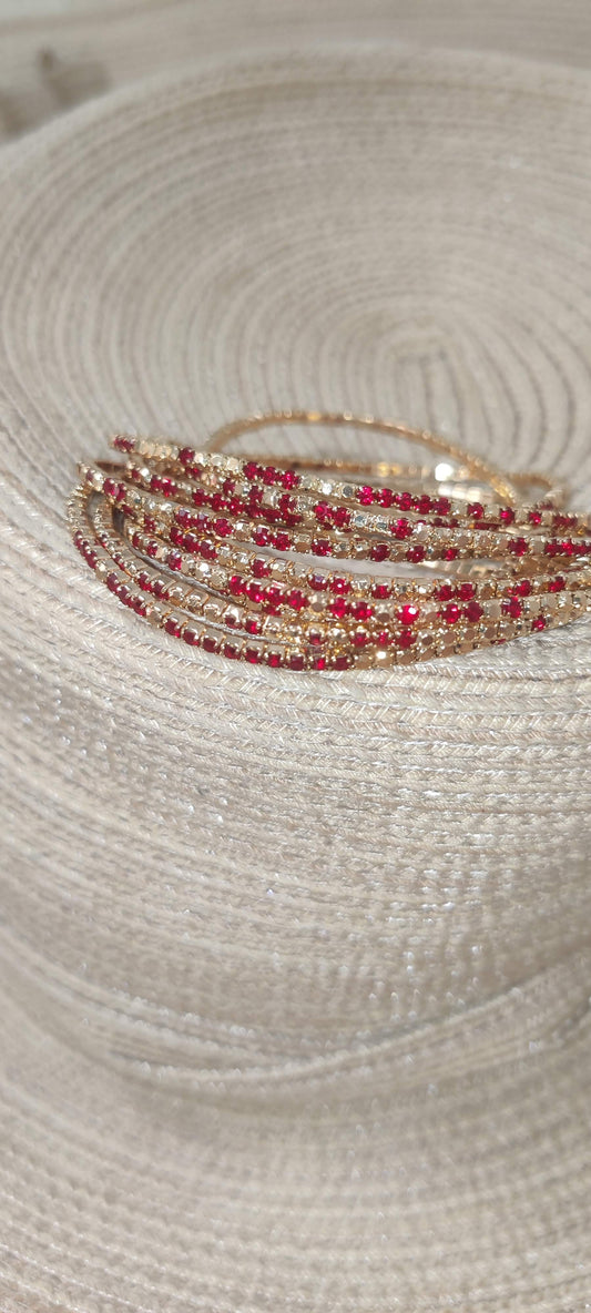 Pulsera elástica de acero dorado con cristales dorados y rojo intenso